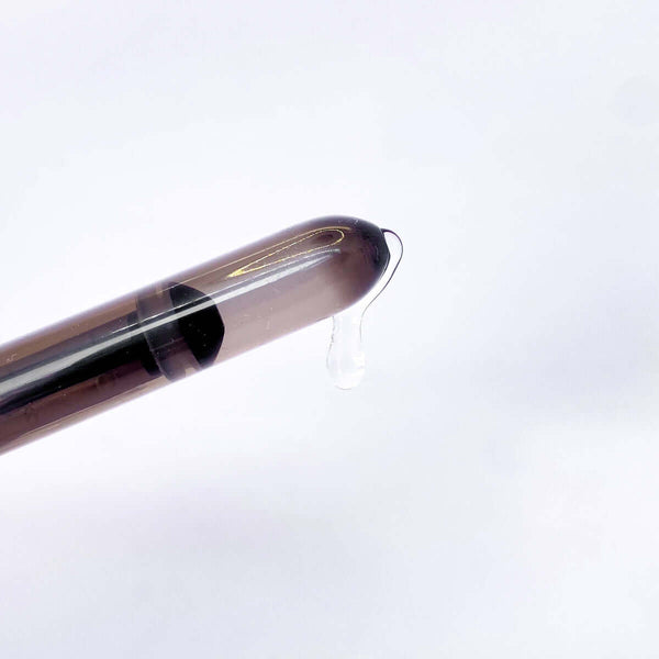 Lube Launcher (10ml) dispenser with lubricant drop ready for use.