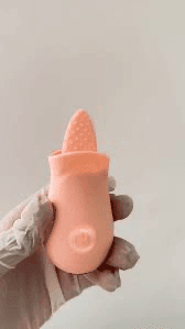 Pleasant Tongue Vibrating Massager in hand showcasing its soft, flexible tip for pleasurable sensations.
