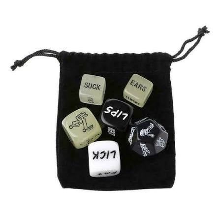 Set of dice with inappropriate text in a black drawstring bag on a white background