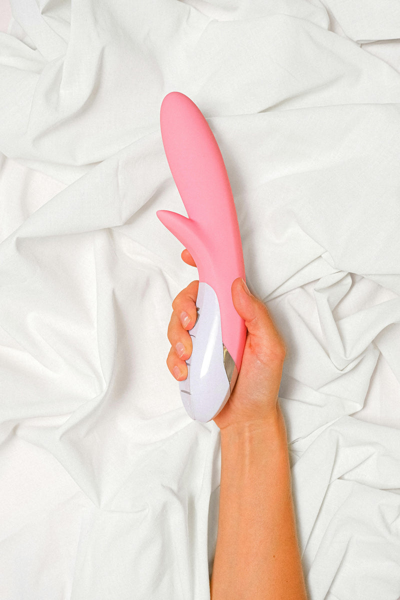 Hand holding personal massage toy from theplaydenza
